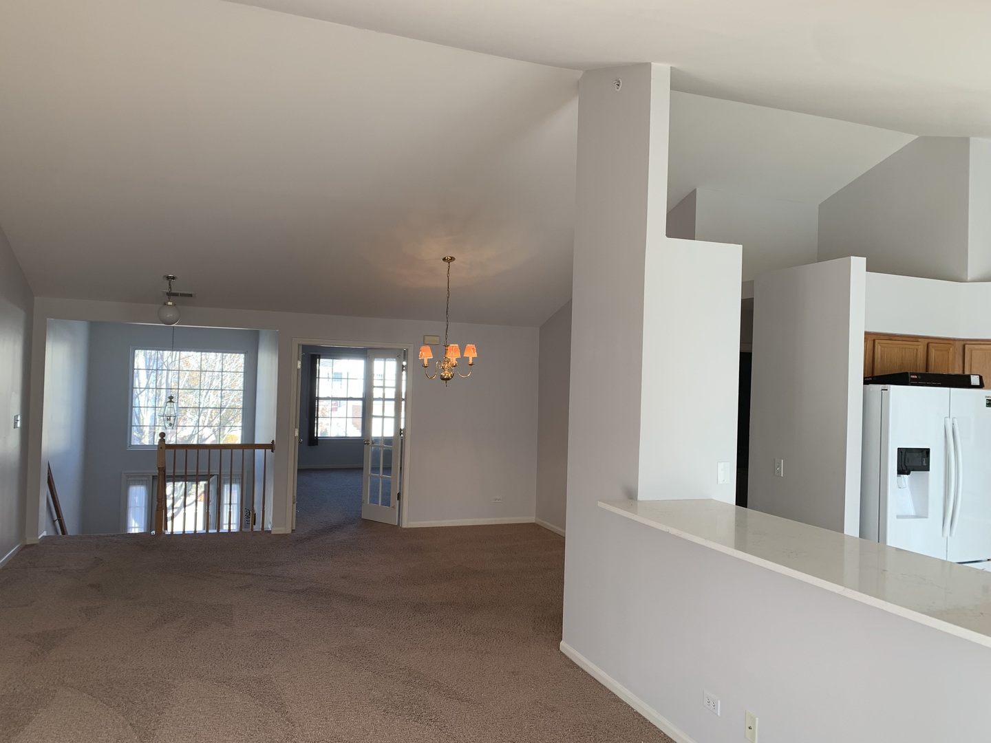 876 Stuarts Drive St. Charles, IL 60174 - Photo 2 of 8 a view of an empty room with a kitchen