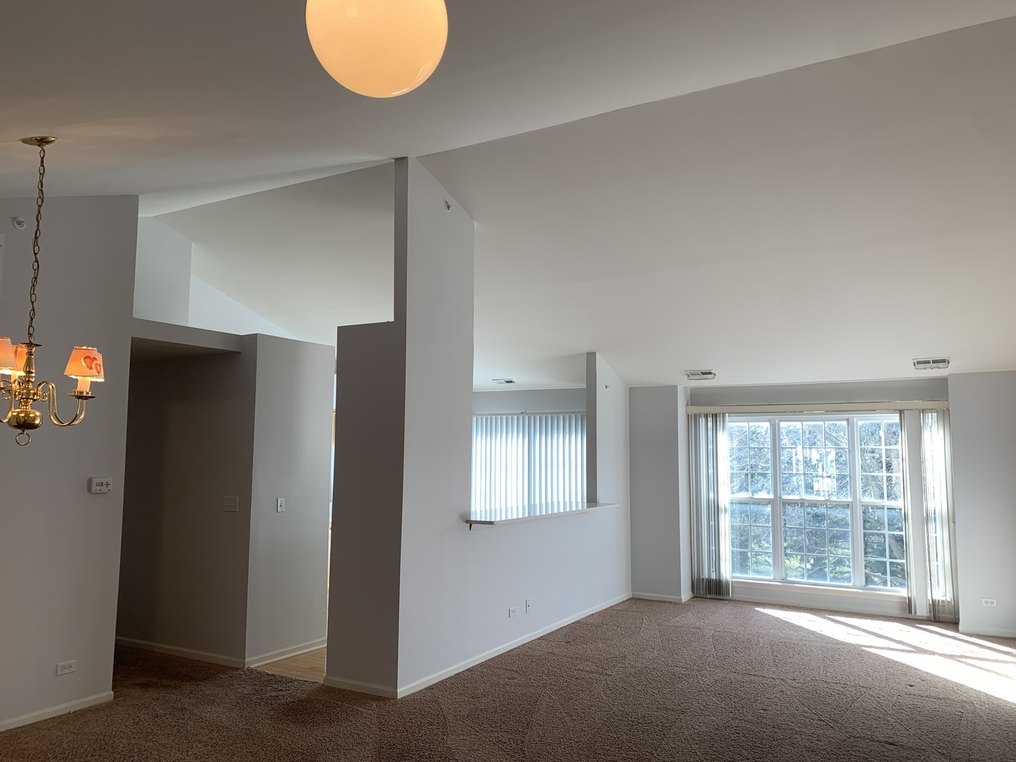 876 Stuarts Drive St. Charles, IL 60174 - Photo 3 of 8 a view of an empty room with a window