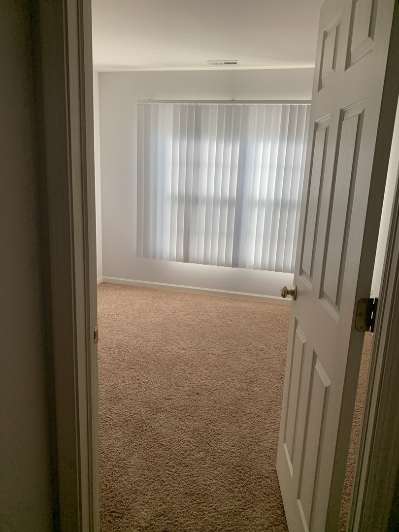 876 Stuarts Drive St. Charles, IL 60174 - Photo 6 of 8 a view of room with front door