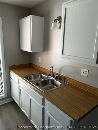 a kitchen with a sink and cabinets