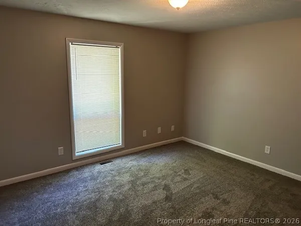 an empty room with a empty space and window