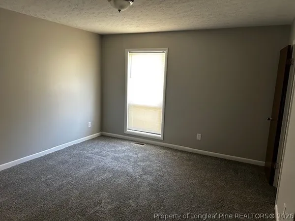 a bathroom with a bathtub and a toilet