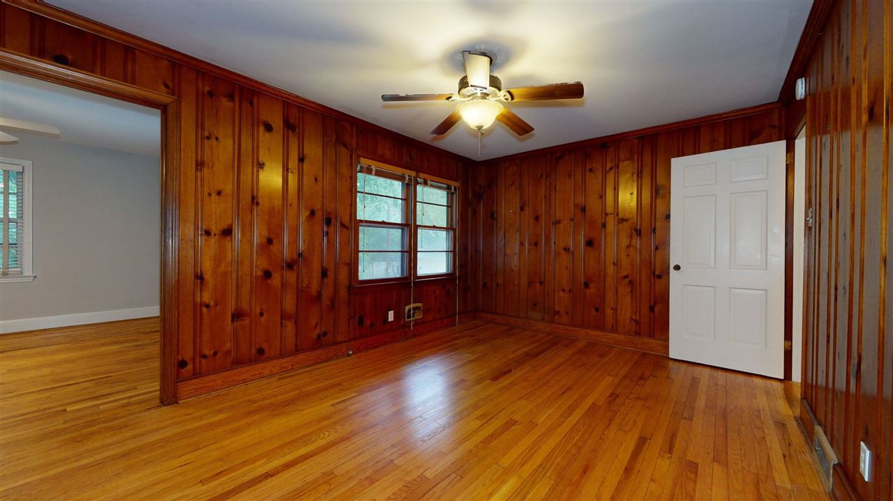 2516 North Roxboro Street Durham, NC 27704 - Photo 9 of 24 Reverse angle shows warm real wood paneling and beautiful hardwood floors. Family Room
