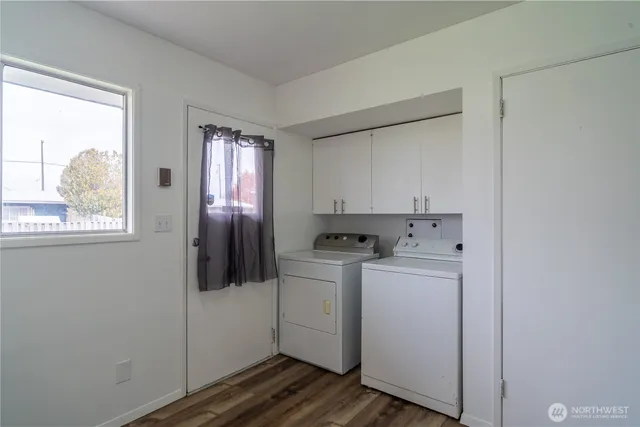 a view of a kitchen with washer and dryer