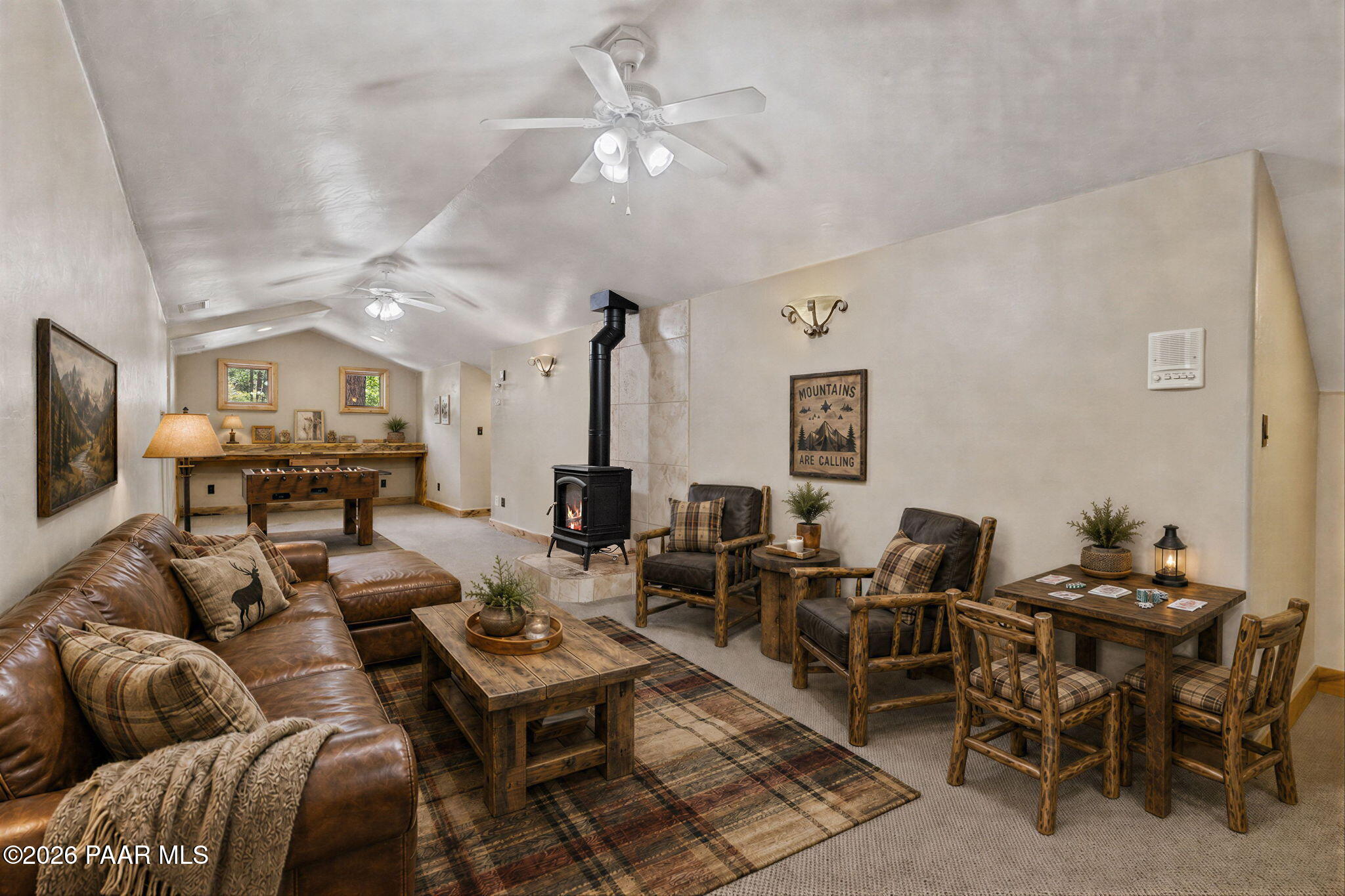 5140 East Charcoal Kiln Road Prescott, AZ 86303 - Photo 61 of 140 a living room with furniture kitchen view and a chandelier