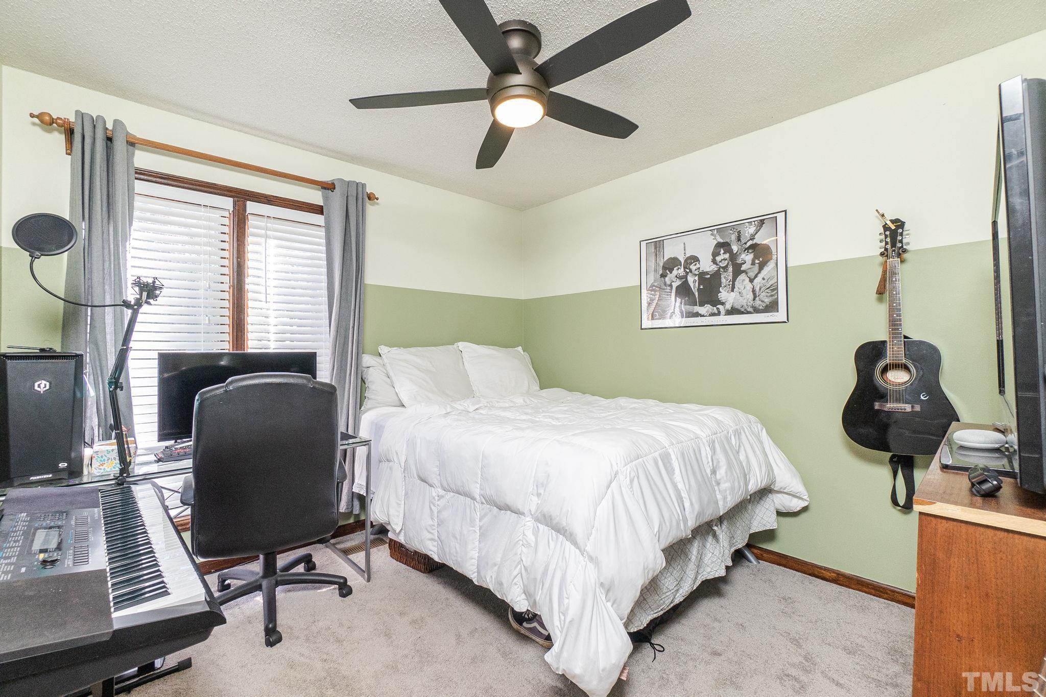 2207 Dorety Place Raleigh, NC 27604 - Photo 16 of 27 a bedroom with a bed and window