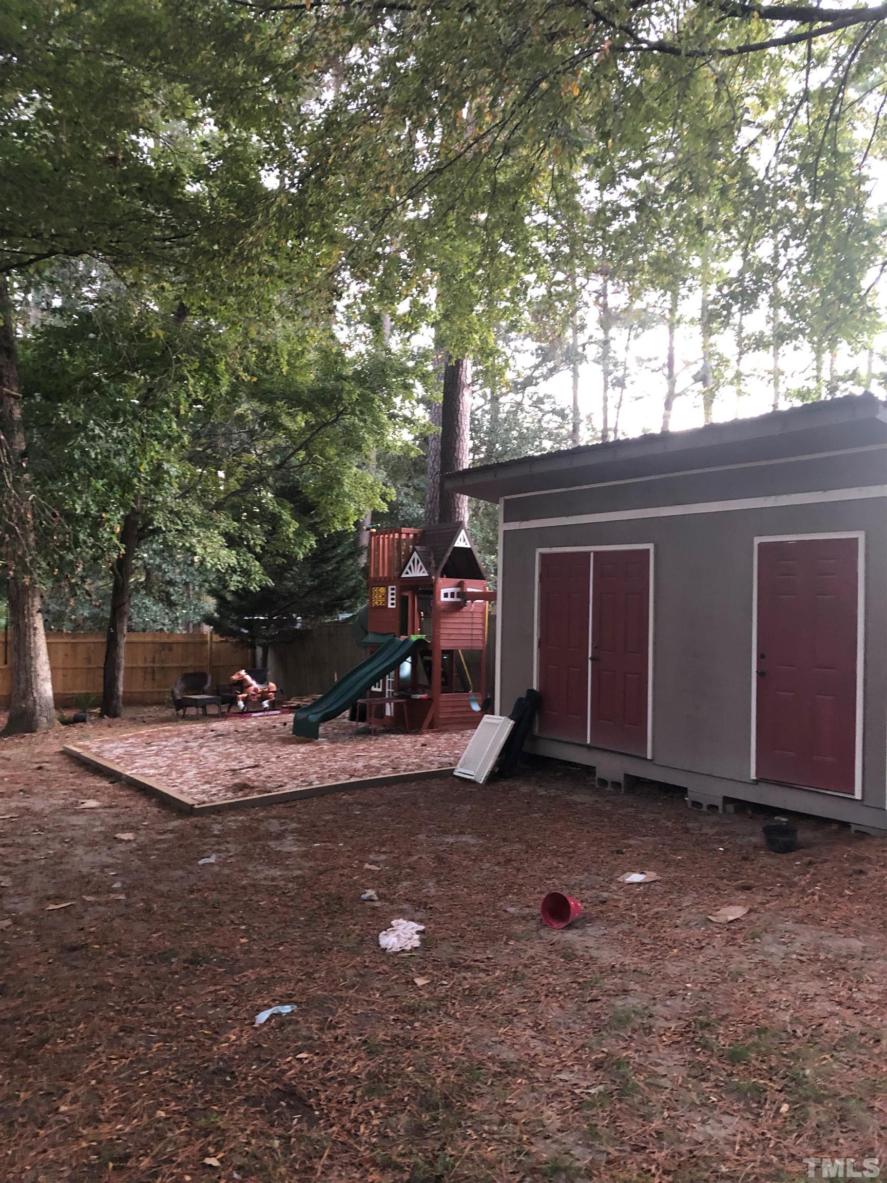 2207 Dorety Place Raleigh, NC 27604 - Photo 3 of 27 a view of outdoor space with deck and tree