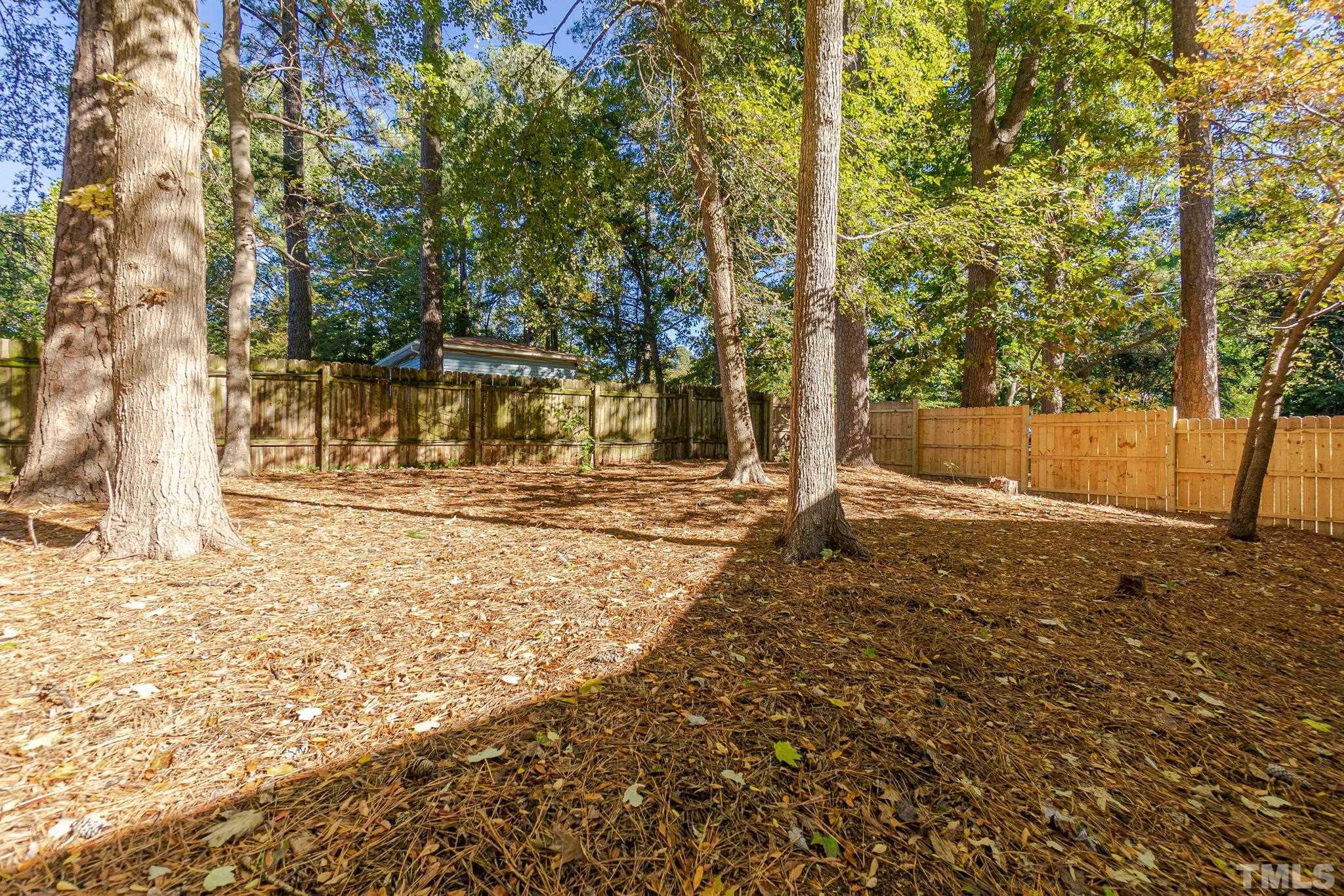 2207 Dorety Place Raleigh, NC 27604 - Photo 26 of 27 a view of a yard with trees