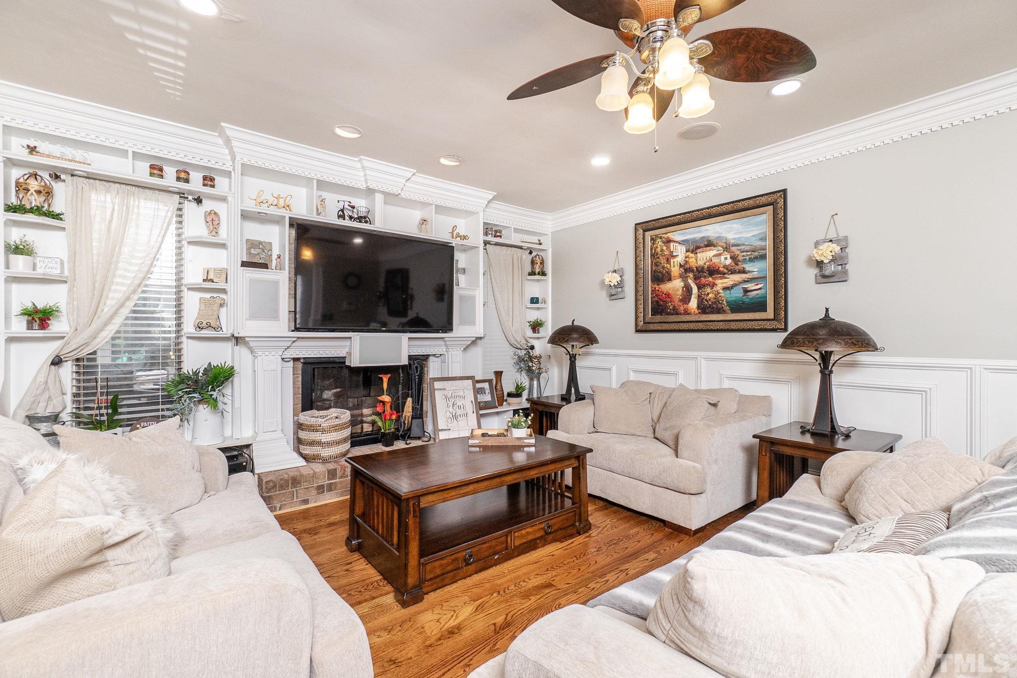 2207 Dorety Place Raleigh, NC 27604 - Photo 6 of 27 a living room with furniture and a flat screen tv