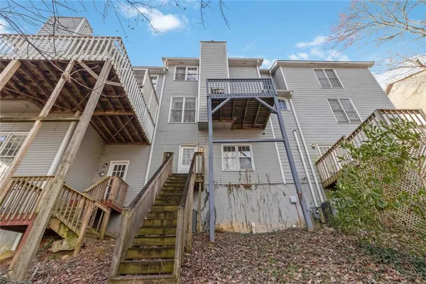 a view of a house with wooden stairs