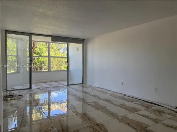 a view of an empty room and window