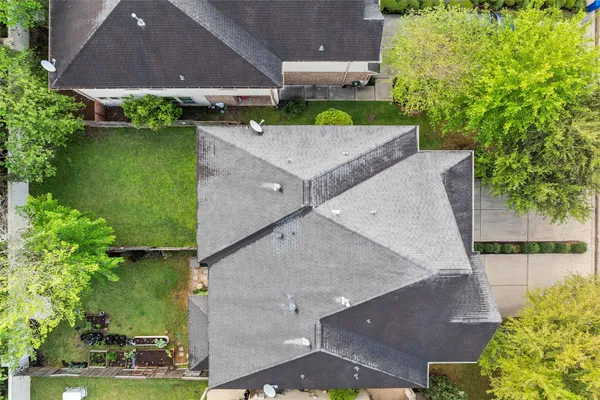 an aerial view of a house with outdoor space