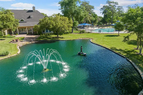 a view of a lake with a yard