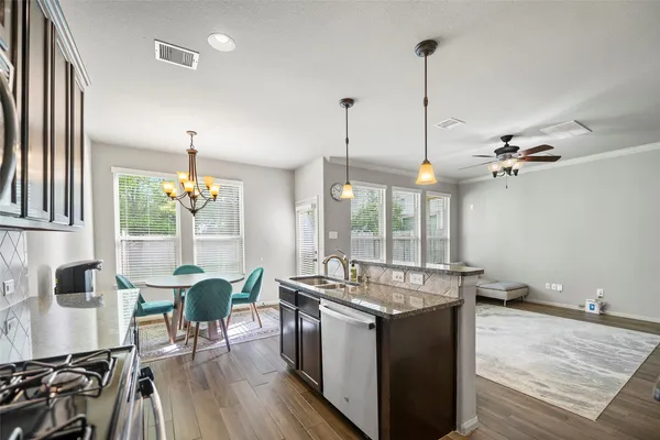 a kitchen with sink and stove