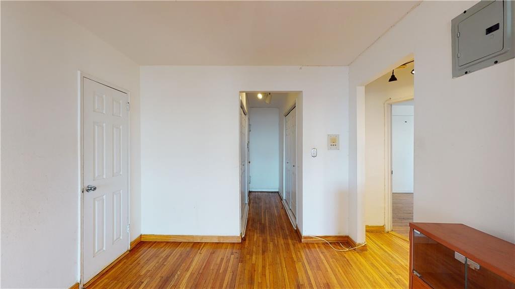 150 West End Avenue, Unit 5H Brooklyn, NY 11235 - Photo 8 of 17 a view of a room with wooden floor and a bathroom