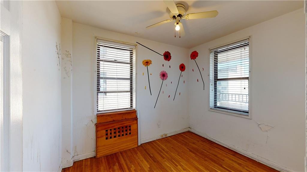 150 West End Avenue, Unit 5H Brooklyn, NY 11235 - Photo 9 of 17 a view of an empty room with a window and wooden floor