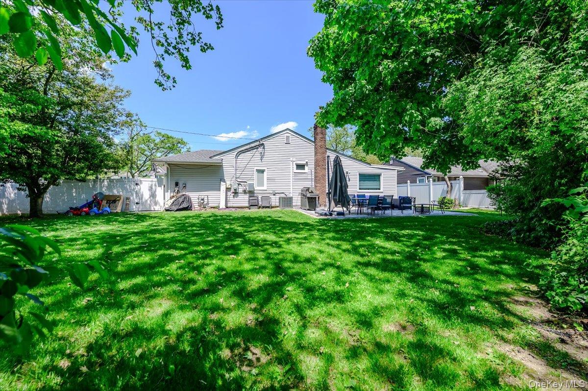 534 Allen Road Woodmere, NY 11598 - Photo 26 of 35 a front view of a house with garden