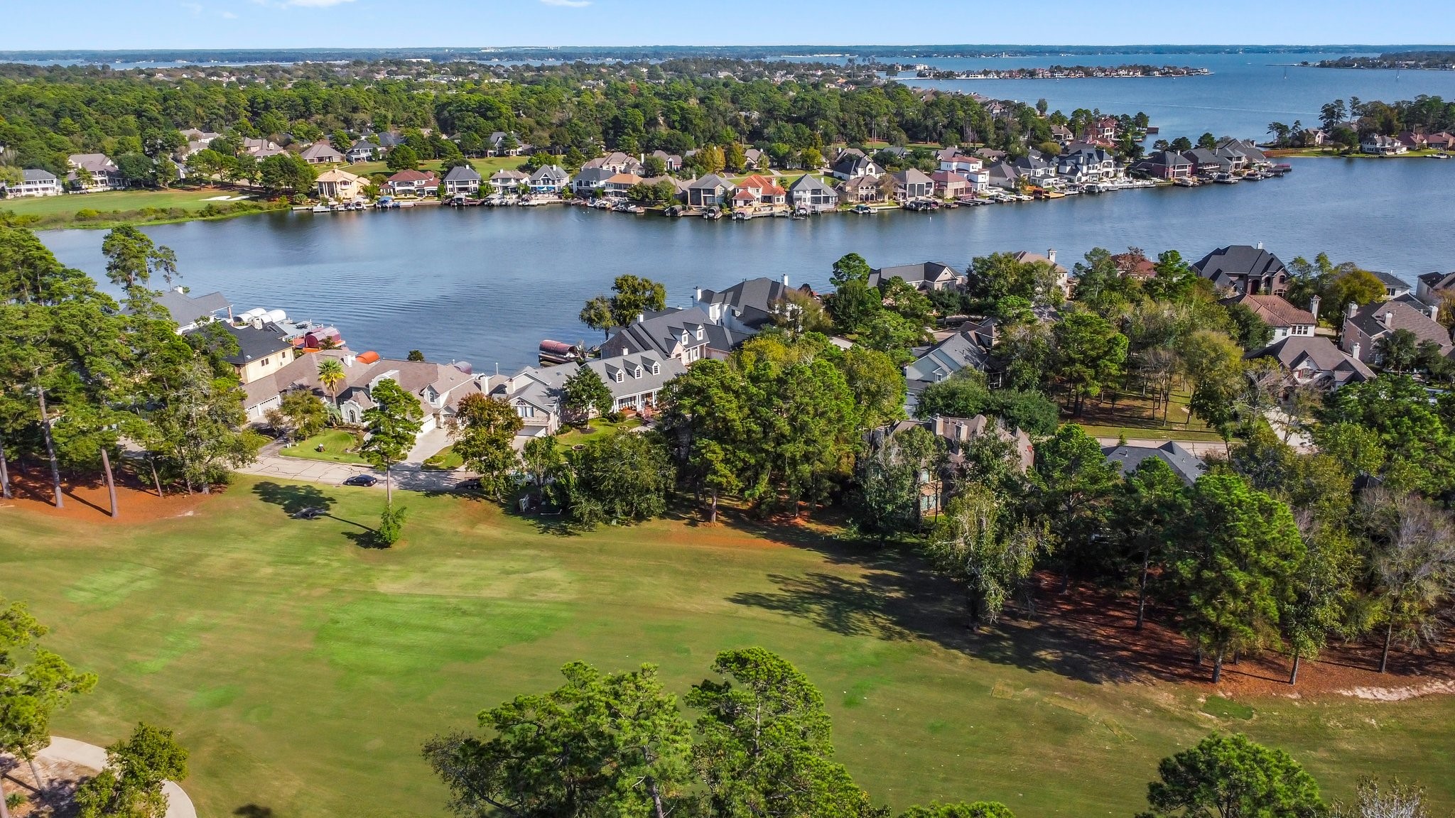 3 West Shore Lane Montgomery, TX 77356 - Photo 19 of 50 an aerial view of residential houses with outdoor space and lake view