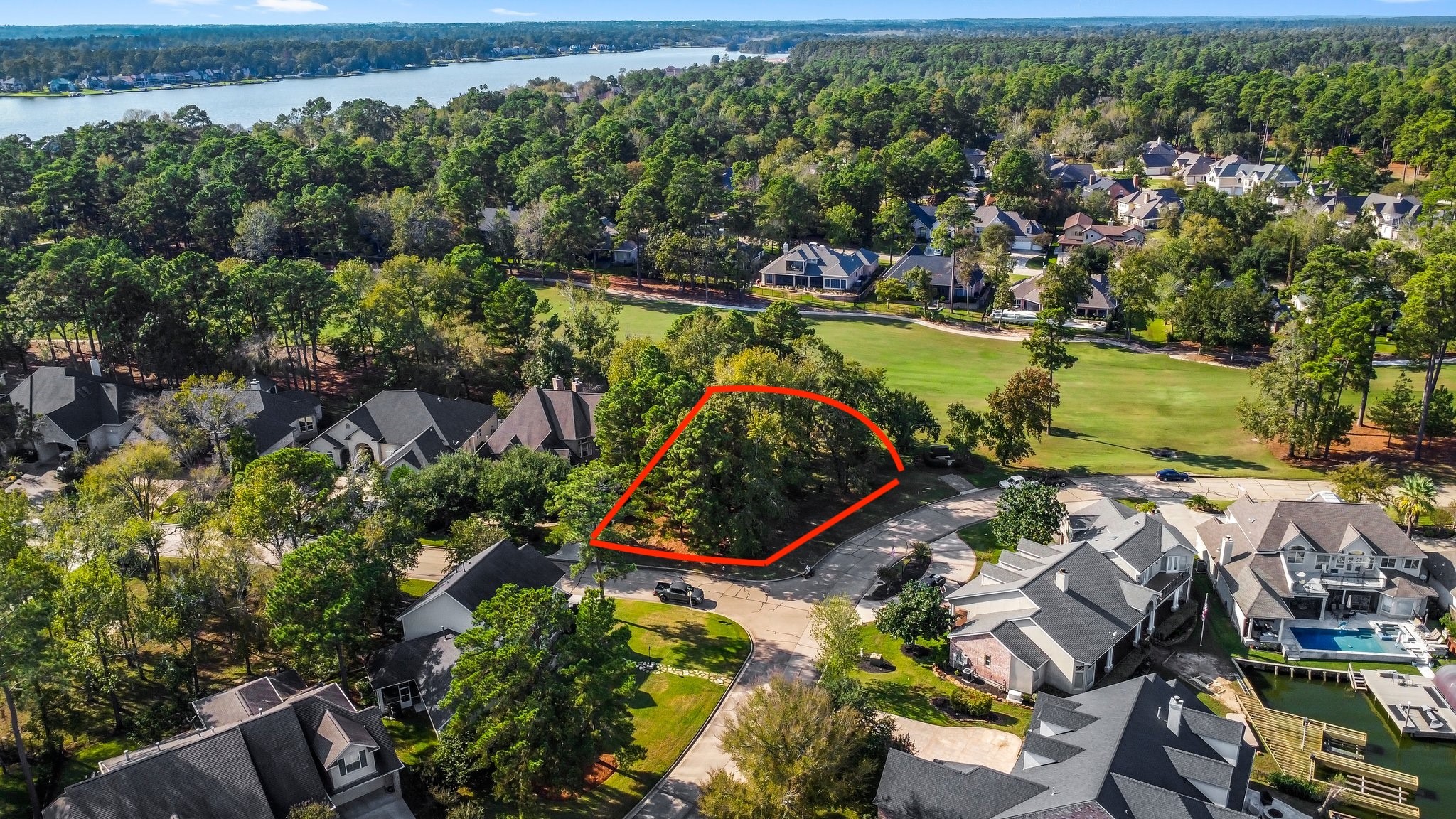 3 West Shore Lane Montgomery, TX 77356 - Photo 2 of 50 an aerial view of a residential houses with outdoor space and trees all around