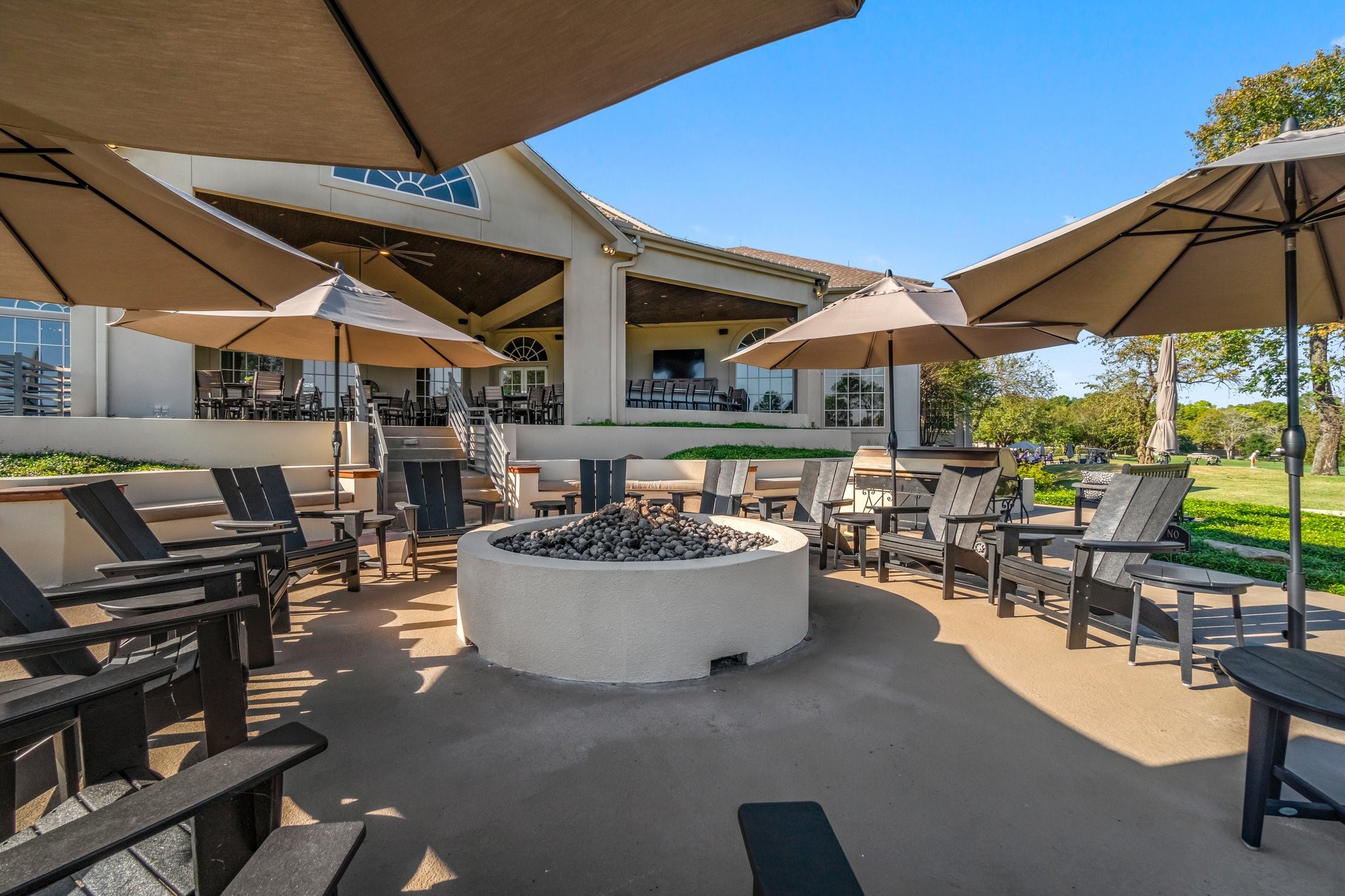 3 West Shore Lane Montgomery, TX 77356 - Photo 29 of 50 a view of a patio with dining table and chairs under an umbrella