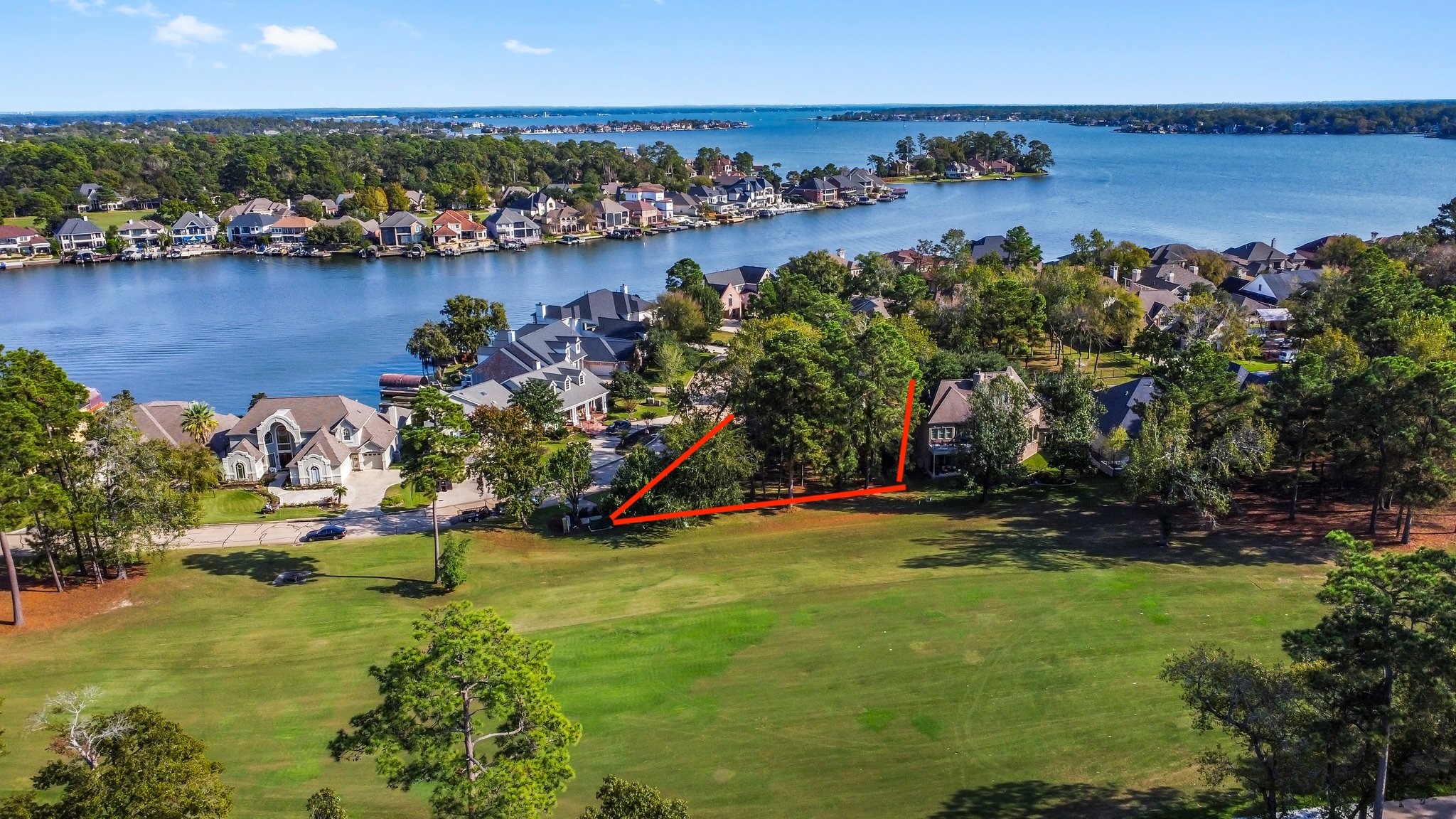 3 West Shore Lane Montgomery, TX 77356 - Photo 4 of 50 a view of a lake with a house