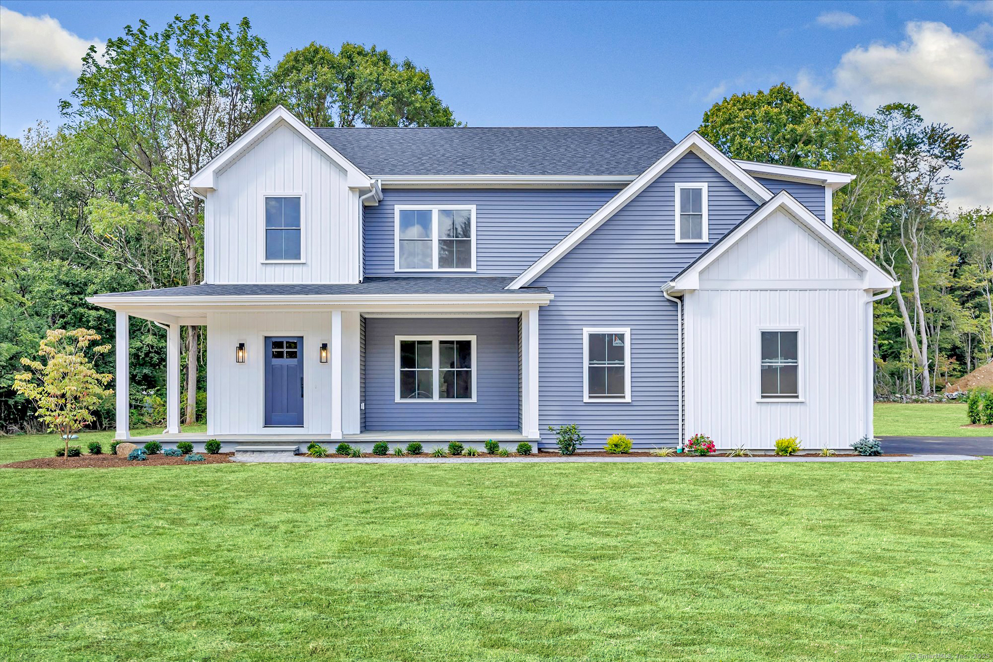 a front view of house with yard and green space