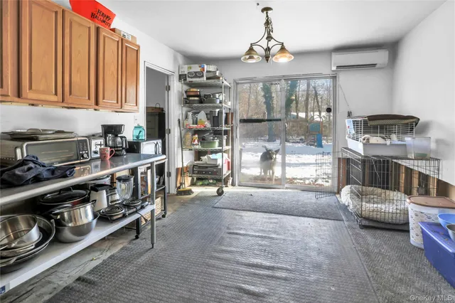 a kitchen area with stainless steel appliances granite countertop a stove and cabinets