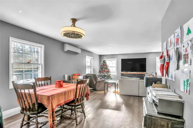 a view of a livingroom with furniture and a flat screen tv