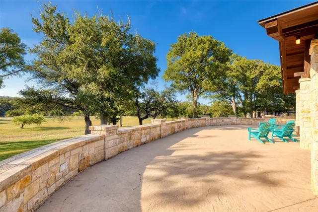 a view of a dinning tables and chairs in a patio