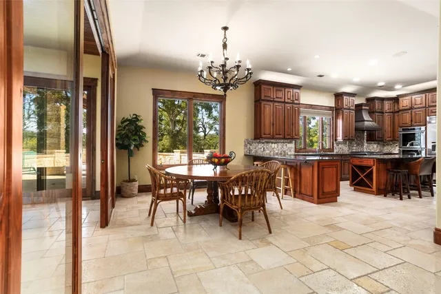 a kitchen with stainless steel appliances granite countertop a sink and cabinets