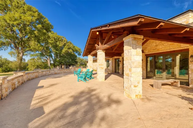 a living room with furniture and a book shelf