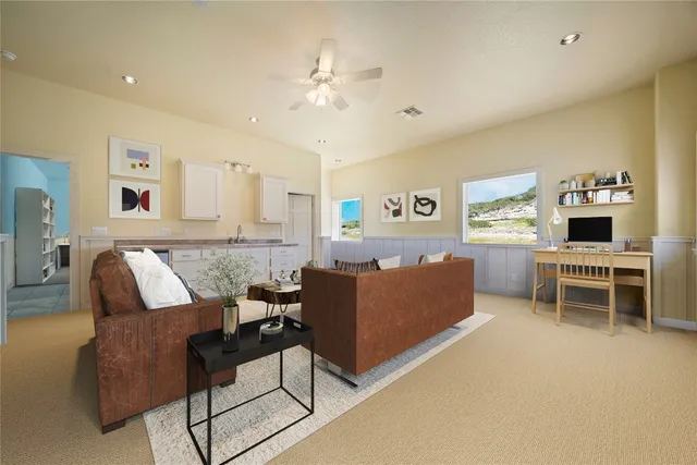 a bedroom with a bed furniture and a flat screen tv