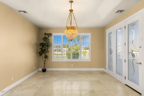 a kitchen with sink and white cabinets