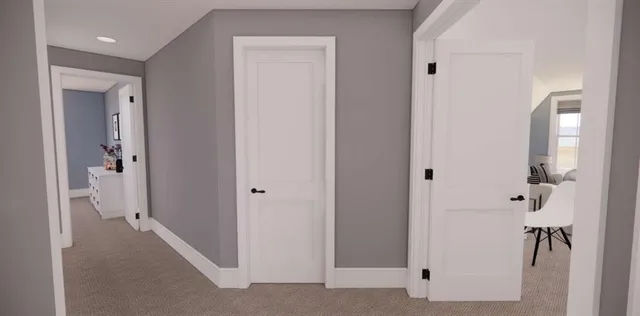a view of a hallway with wooden floor and a potted plant