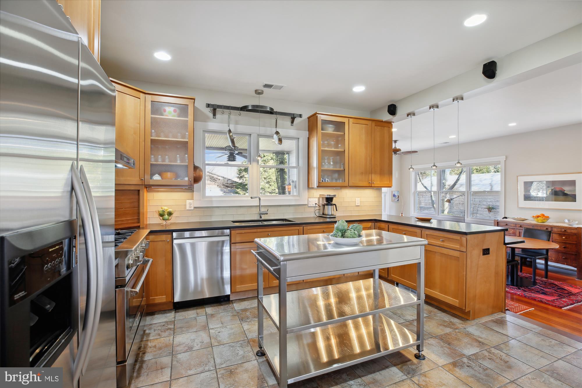 9411 Garwood Street Silver Spring, MD 20901 - Photo 12 of 90 a kitchen with stainless steel appliances granite countertop a sink and a refrigerator