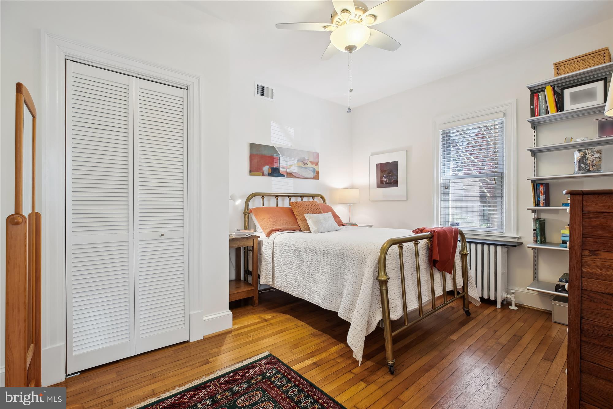 9411 Garwood Street Silver Spring, MD 20901 - Photo 25 of 90 a bedroom with a bed and a chandelier