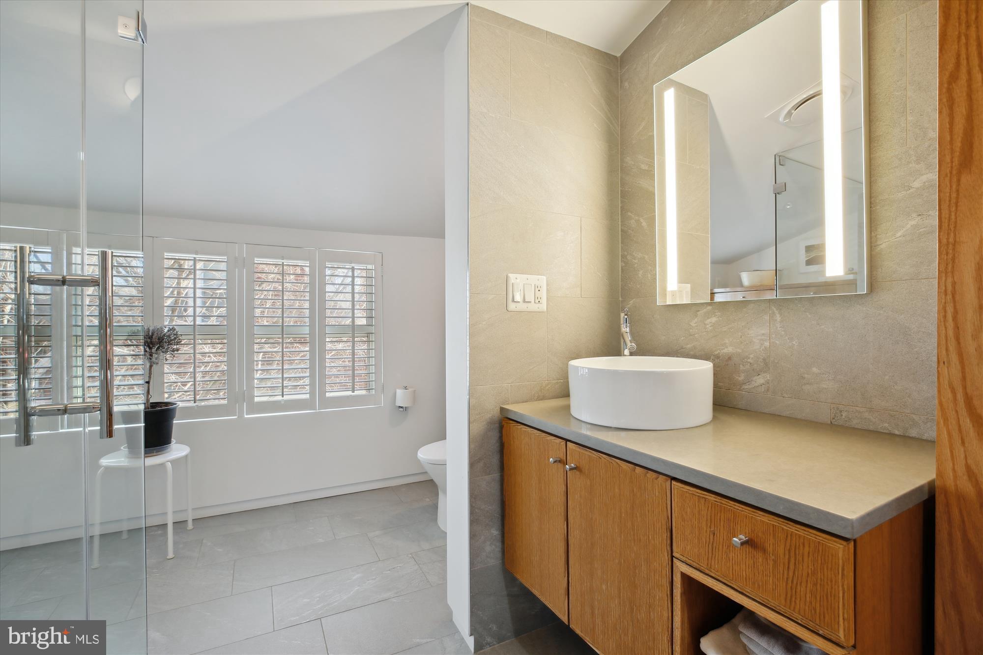 9411 Garwood Street Silver Spring, MD 20901 - Photo 33 of 90 a bathroom with a sink and a vanity