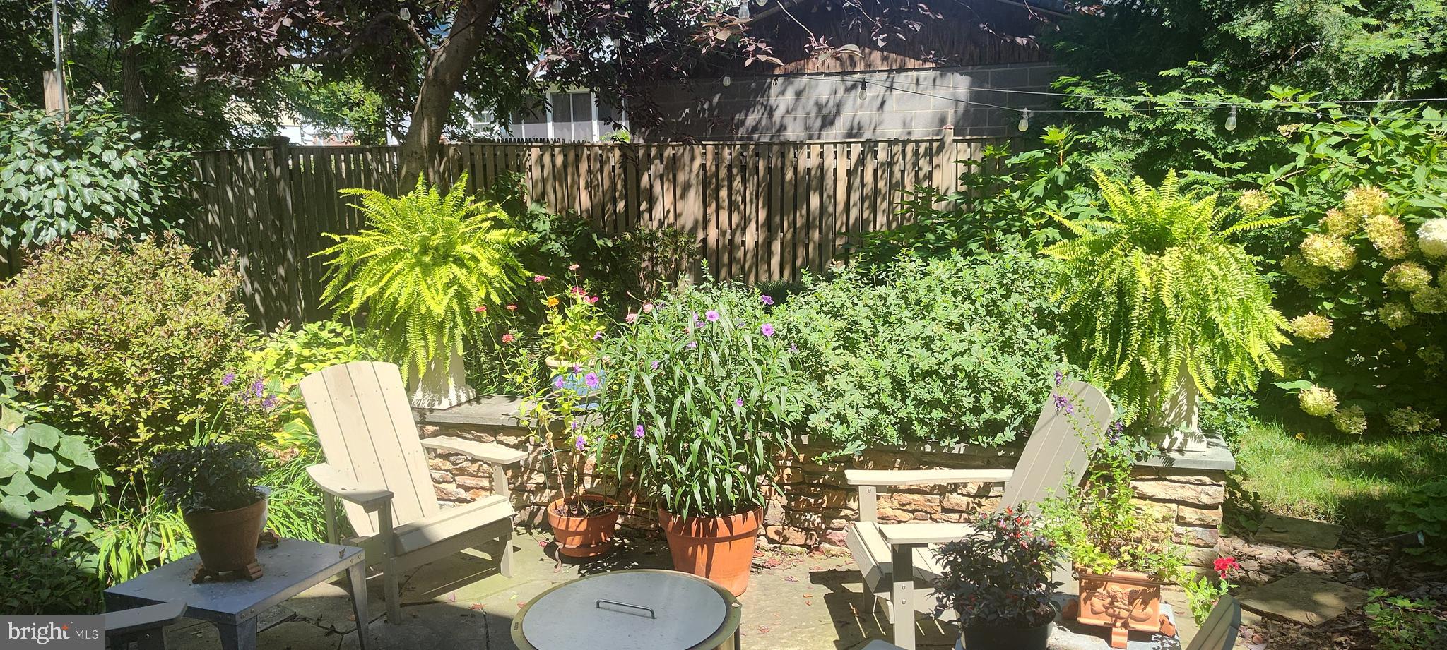 9411 Garwood Street Silver Spring, MD 20901 - Photo 58 of 90 a backyard of a house with lots of green space