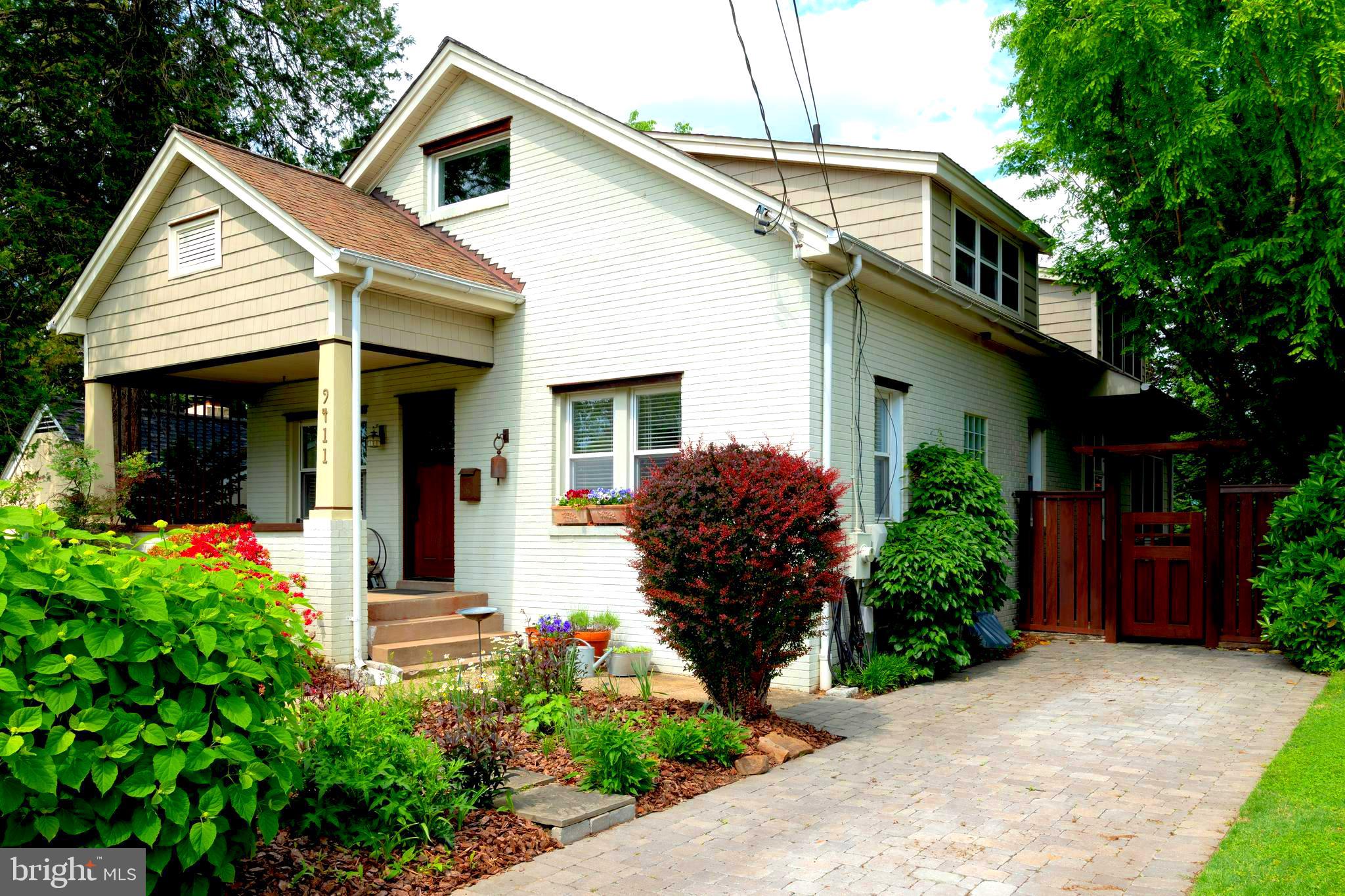 9411 Garwood Street Silver Spring, MD 20901 - Photo 67 of 90 a front view of a house with garden