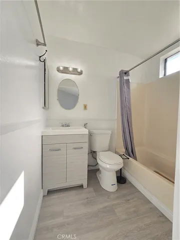 a view of backyard with wooden fence