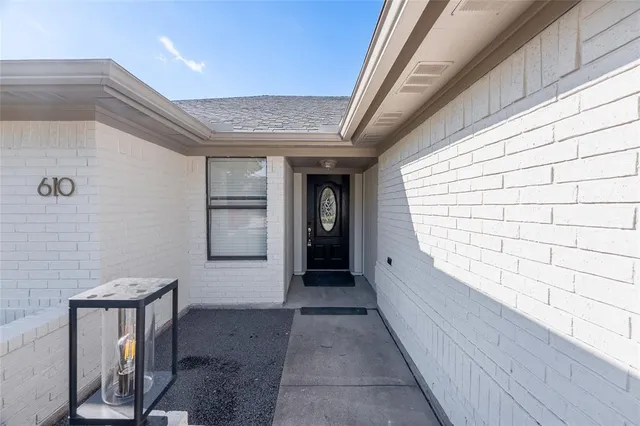 a view of a porch with wooden floor and staircase