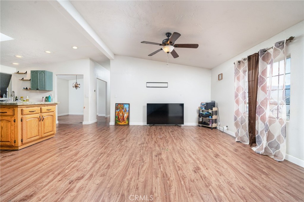 13221 Arena Road Pinon Hills, CA 92372 - Photo 5 of 19 a view of empty room with wooden floor and fan