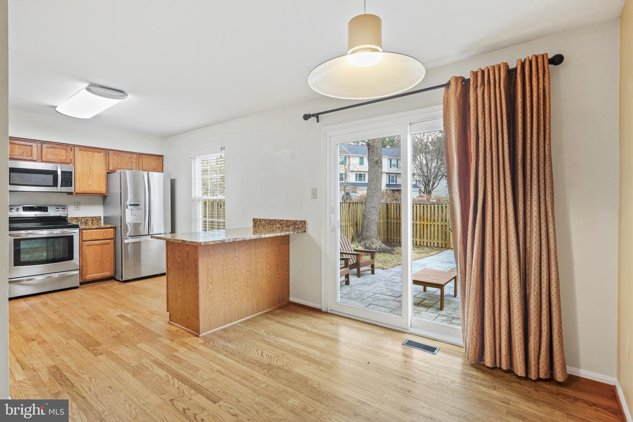 4723 Hallowed Streme Ellicott City, MD 21042 - Photo 12 of 40 Bright and inviting kitchen with outdoor access.