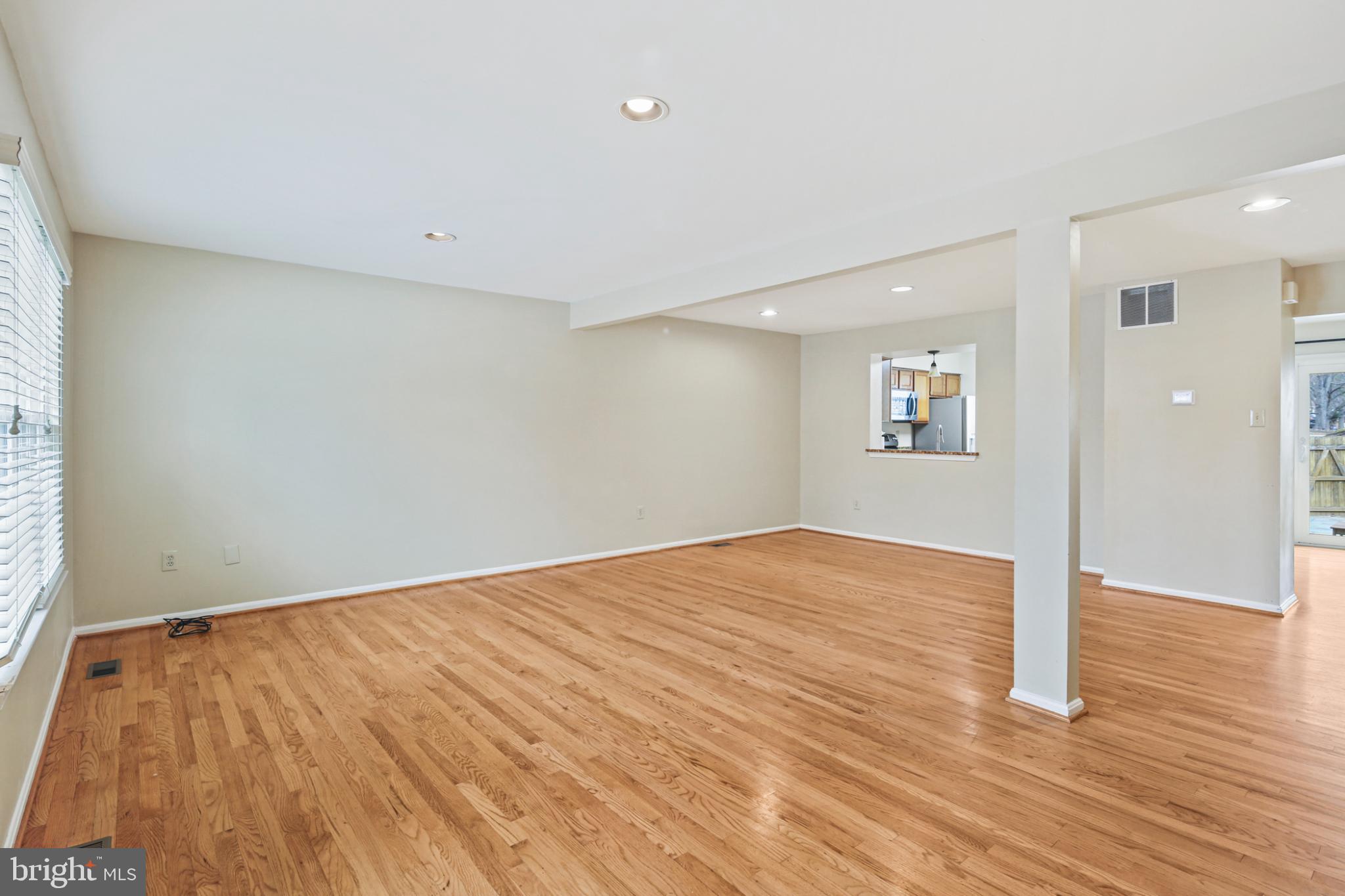 4723 Hallowed Streme Ellicott City, MD 21042 - Photo 33 of 40 Spacious, sunlit living area with hardwood floors.