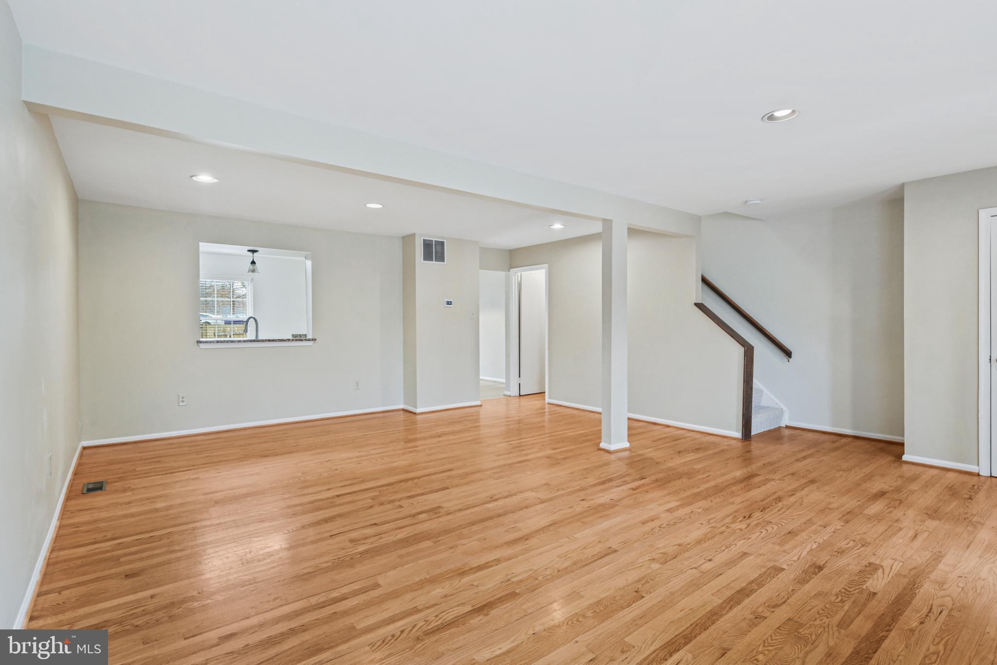 4723 Hallowed Streme Ellicott City, MD 21042 - Photo 5 of 40 Spacious, sunlit living area with hardwood floors.