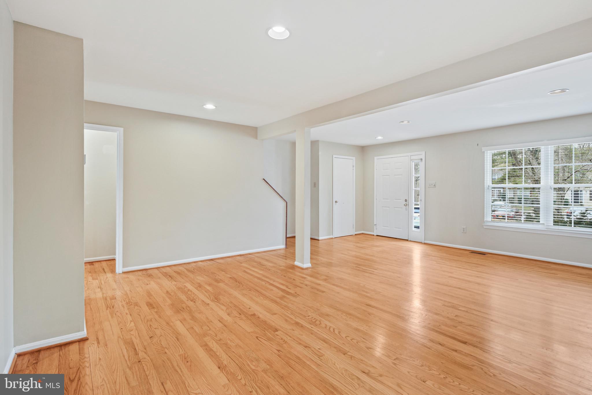 4723 Hallowed Streme Ellicott City, MD 21042 - Photo 7 of 40 Spacious, sunlit living area with hardwood floors.