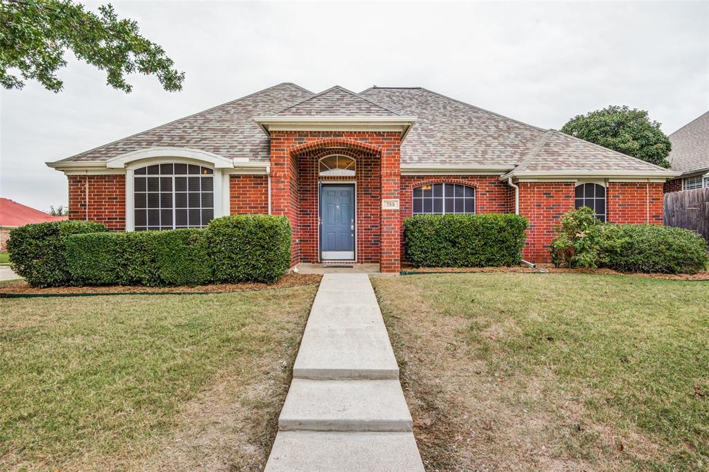 765 Summit Ridge Lewisville, TX 75077 - Photo 1 of 1 front view of a house with a yard