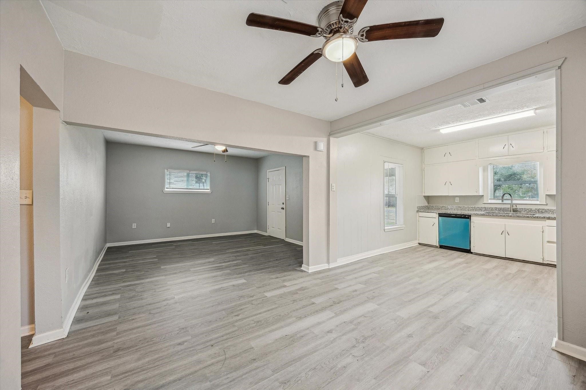710 East Magnolia Street Angleton, TX 77515 - Photo 3 of 9 a view of a kitchen with a sink and a window