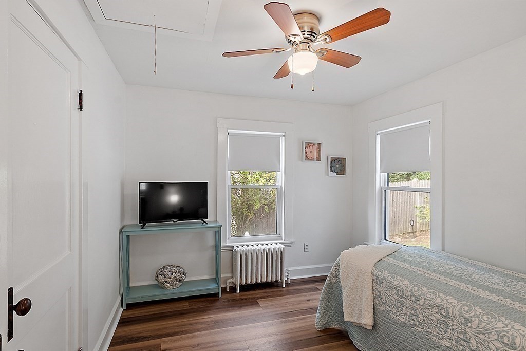 26 Madison Square Gloucester, MA 01930 - Photo 13 of 27 a living room with furniture and a flat screen tv