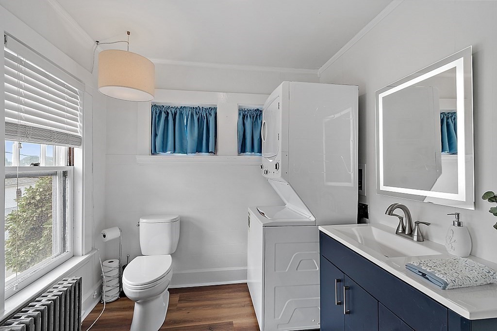 26 Madison Square Gloucester, MA 01930 - Photo 4 of 27 a bathroom with a sink toilet and mirror